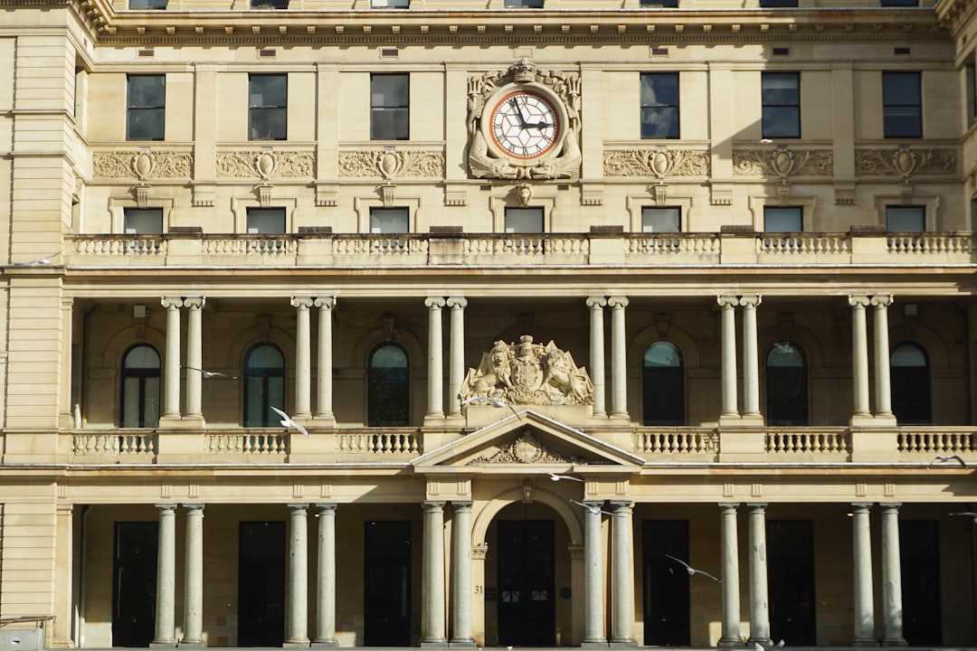 Illustration: Ornate building facade with columns and clock