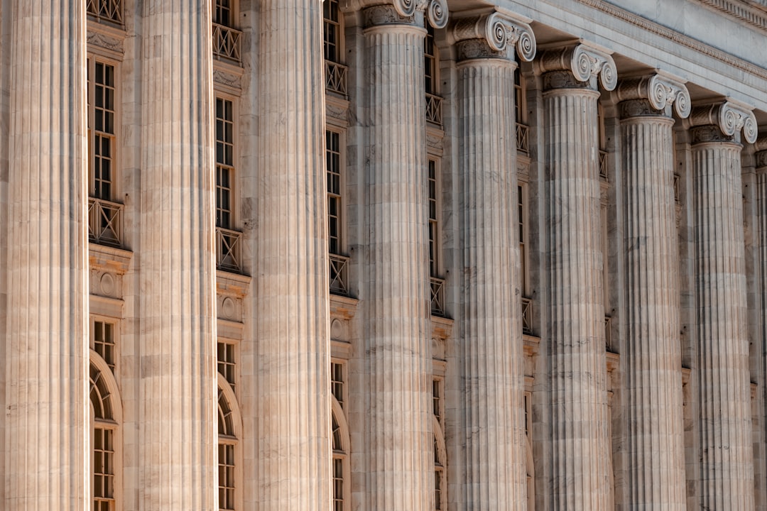 Illustration: a large building with columns and a clock on the front of it
